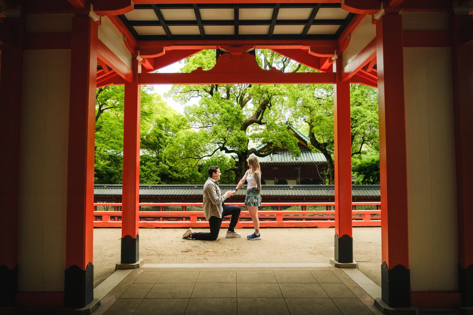 The proposal framed by red shrine pillars
