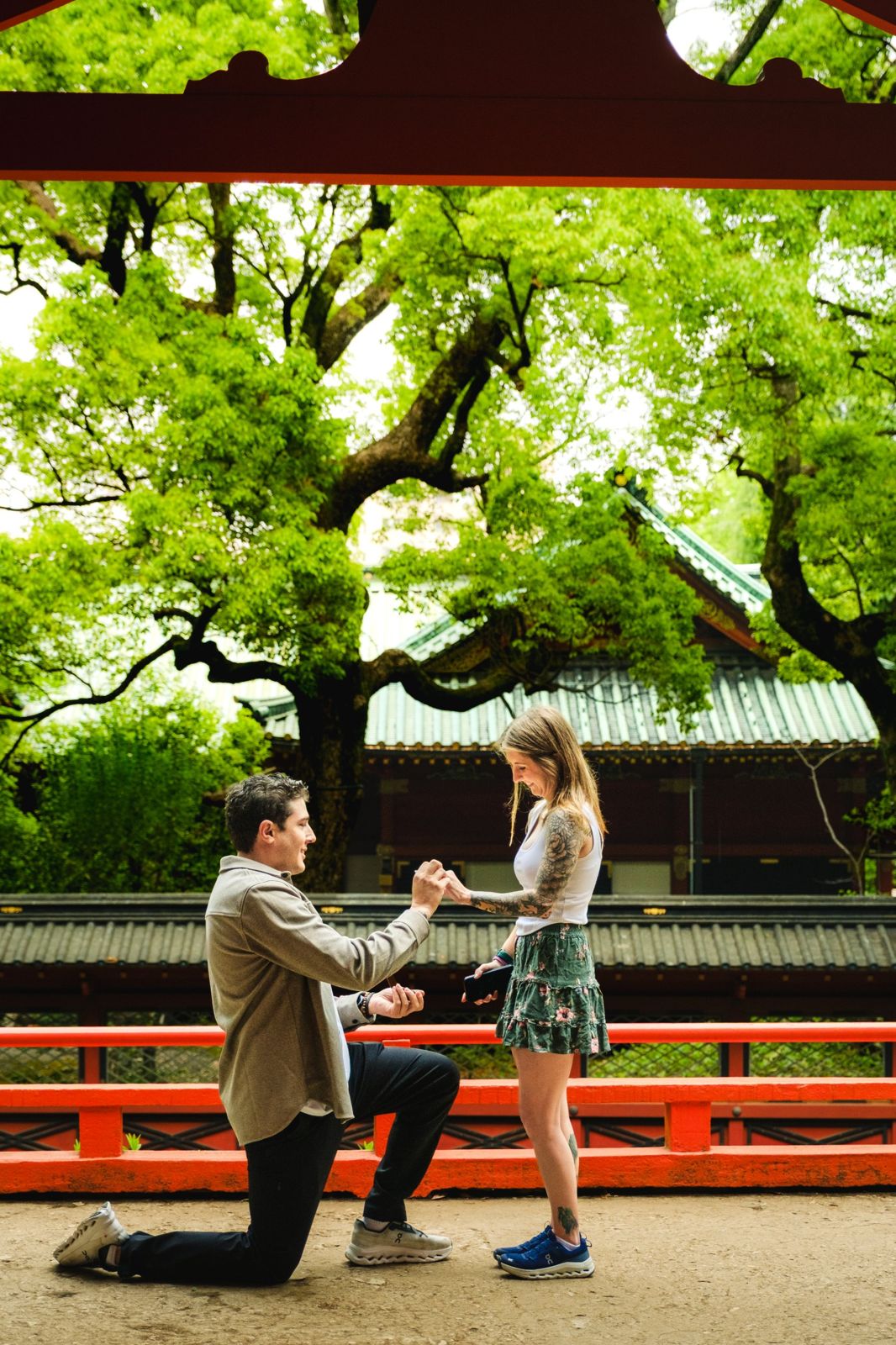 Matt proposing to Maddie at a red shrine in Japan
