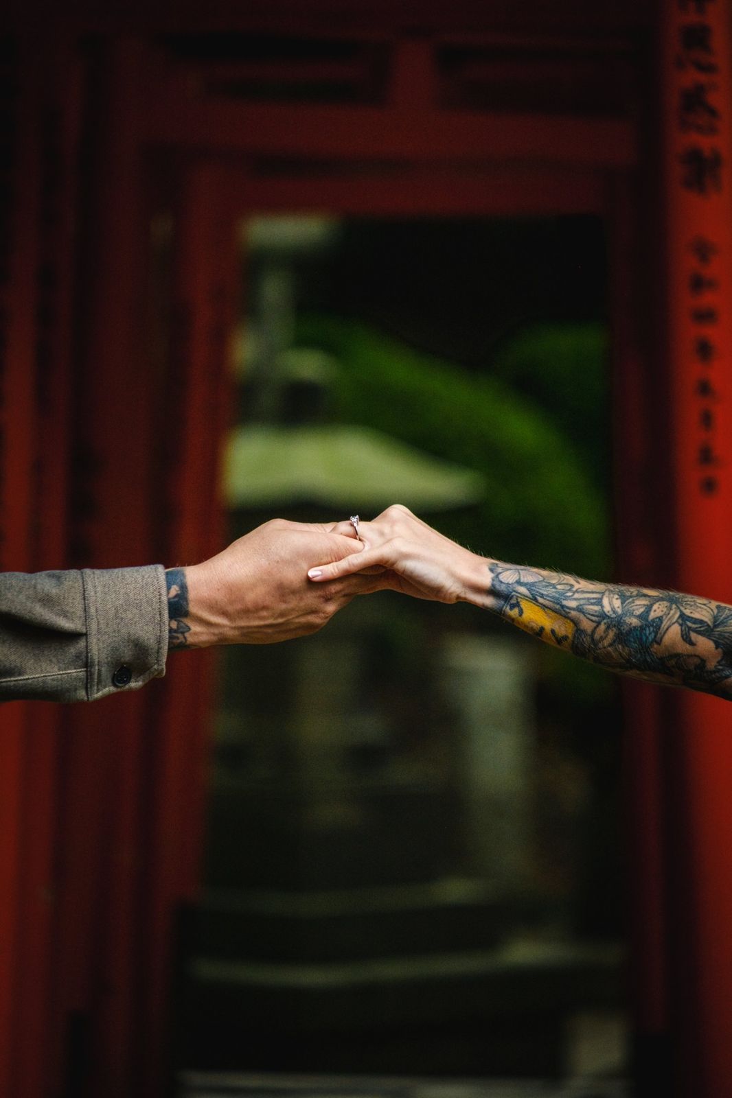 Maddie and Matt holding hands, showing the ring