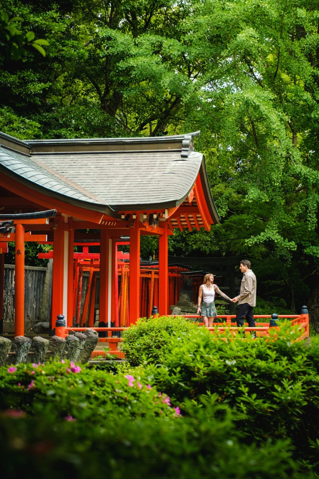 Walking hand in hand by the shrine gardens