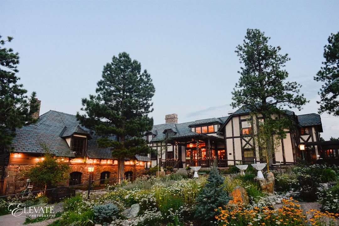 The mansion lit up at dusk